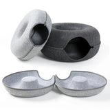 Soft donut-shaped cat bed by Smartlyo with plush fabric and cozy circular design for comfortable feline lounging.