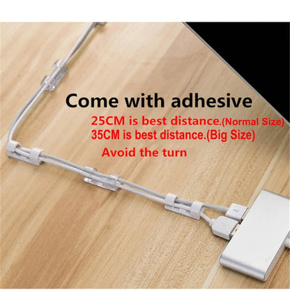 Set of 20 transparent adhesive cable clips from Smartlyo, showing organized cables secured neatly to a surface.