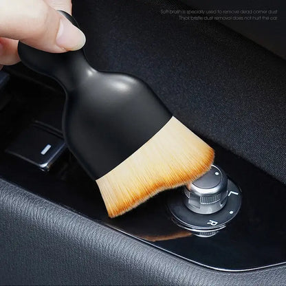 Smartlyo car interior cleaning fluff brush with soft bristles for removing dust and debris from vehicle seats and dashboards.