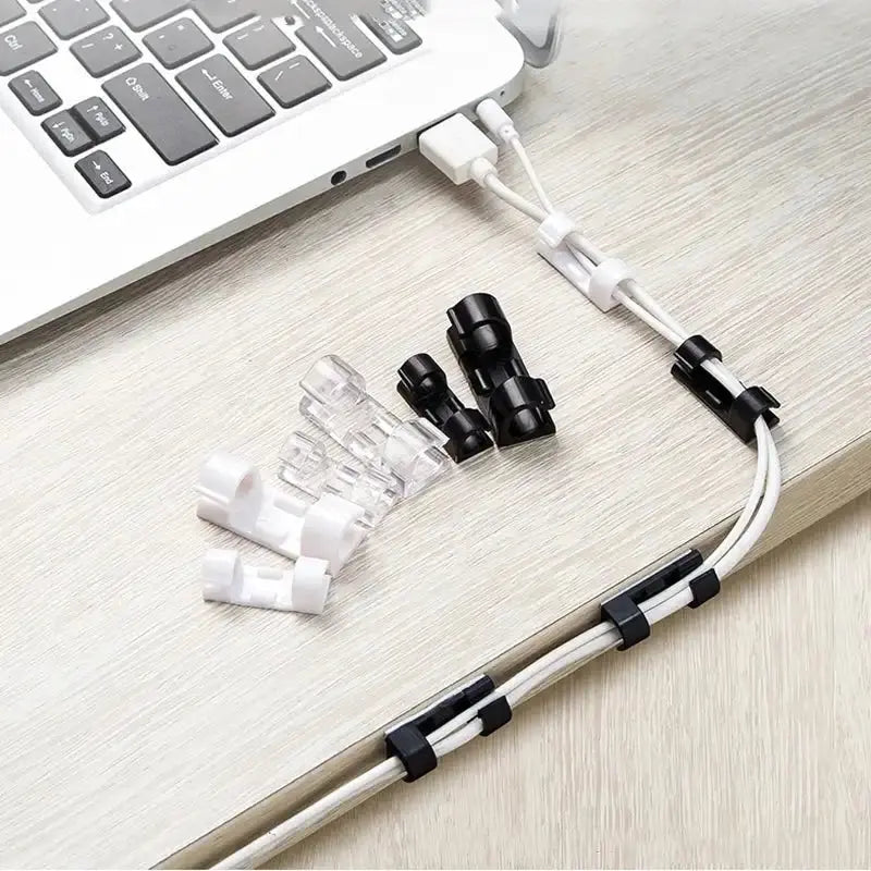 Set of 20 transparent adhesive cable clips by Smartlyo for organizing and securing cables neatly on surfaces.