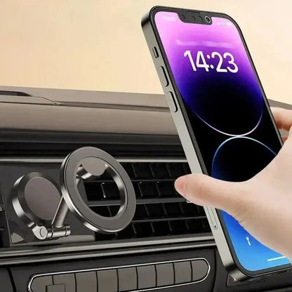 Smartlyo 360° magnetic cell phone holder mounted on a car dashboard with a phone secured in place for hands-free use.
