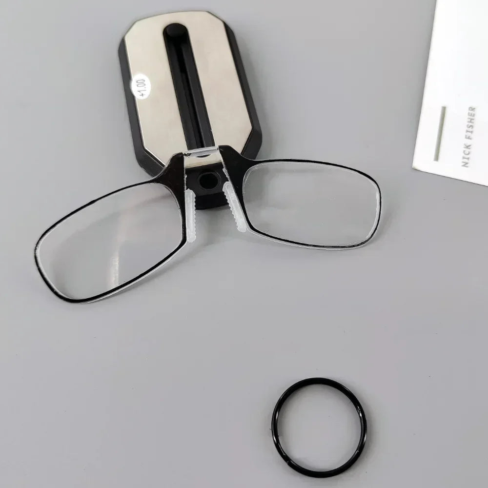 Folding pocket reading glasses with black frames and compact design, ideal for on-the-go reading assistance.