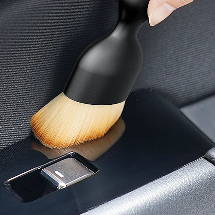 Smartlyo car interior cleaning fluff brush with soft bristles for removing dust and debris from tight spaces and upholstery.