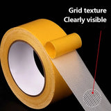 Double-sided tape by Smartlyo, high viscosity grid fiber adhesive tape shown in close-up with textured grid pattern.