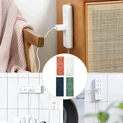 Set of 10 Smartlyo self-adhesive socket holders attached to a wall for secure organization of electrical sockets