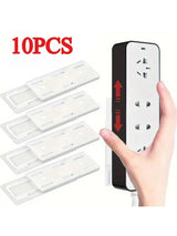 Set of 10 Smartlyo self-adhesive socket holders attached to a wall for organized power strip cable management.
