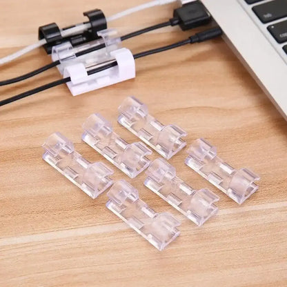 Set of 20 transparent adhesive cable clips by Smartlyo for organizing and securing cords and cables neatly.