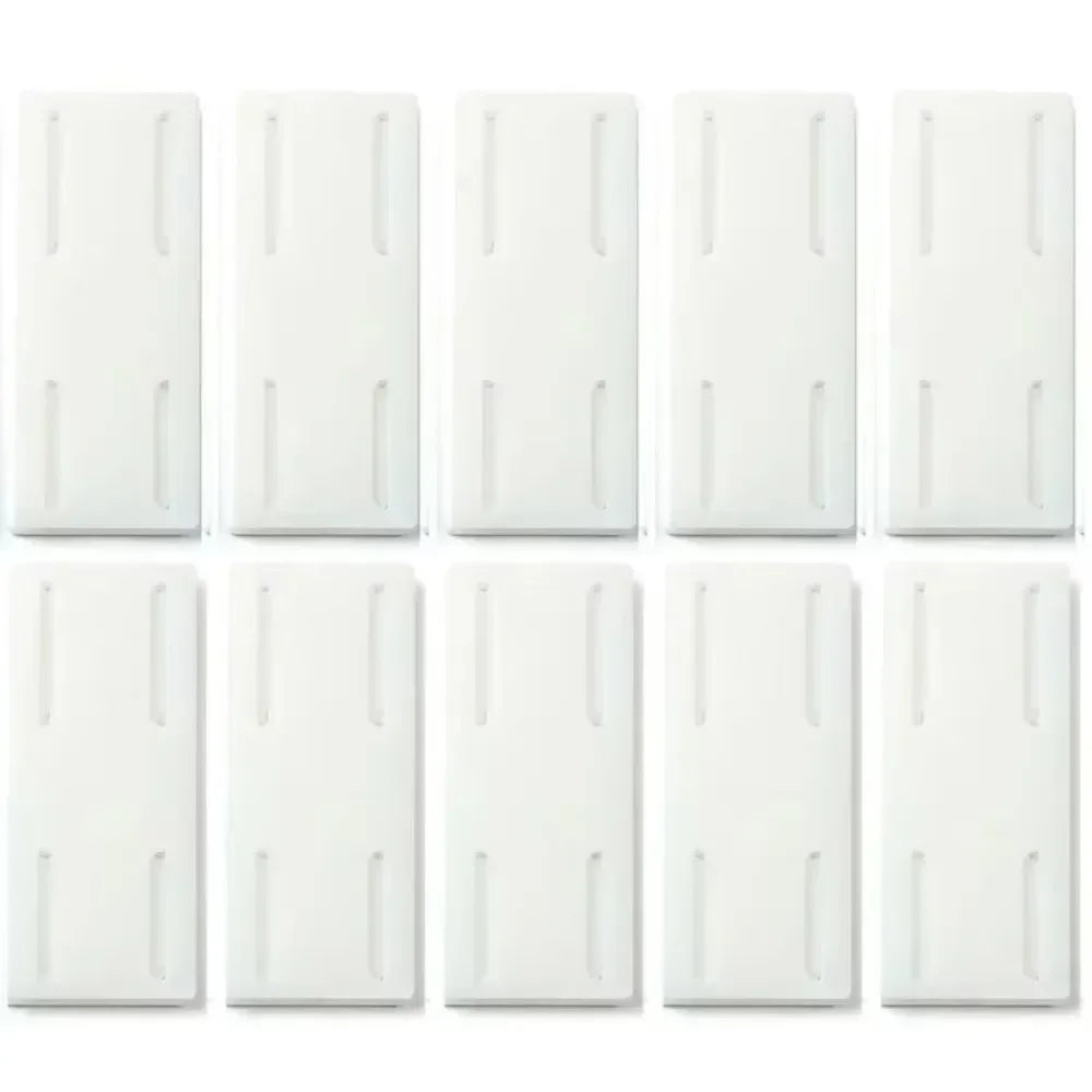 Set of 10 Smartlyo self-adhesive socket holders attached to a wall for organizing electrical outlets.