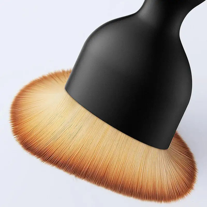 Smartlyo Car interior cleaning fluff brush, compact tool with soft bristles for removing dust and debris from car surfaces.