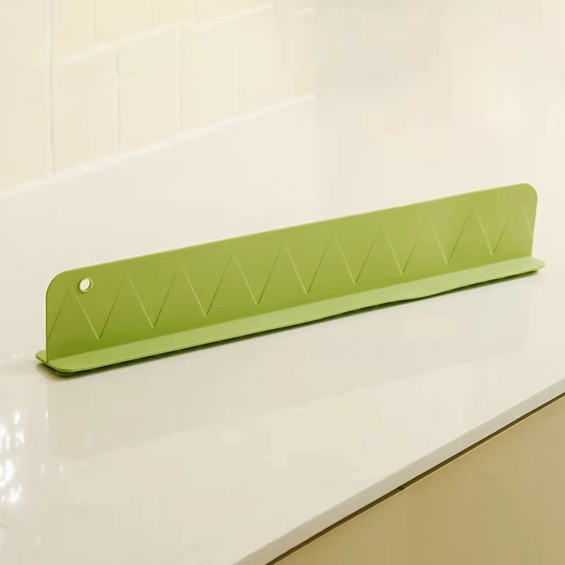 Rafford silicone sink splash guard with suction cups, made by Smartlyo, shown attached to a kitchen sink for preventing water splashes
