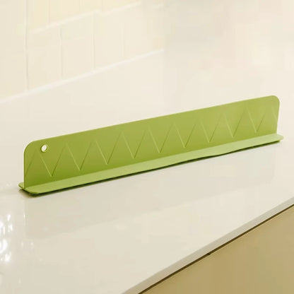 Rafford silicone sink splash guard with suction cups, made by Smartlyo, shown attached to a kitchen sink for preventing water splashes