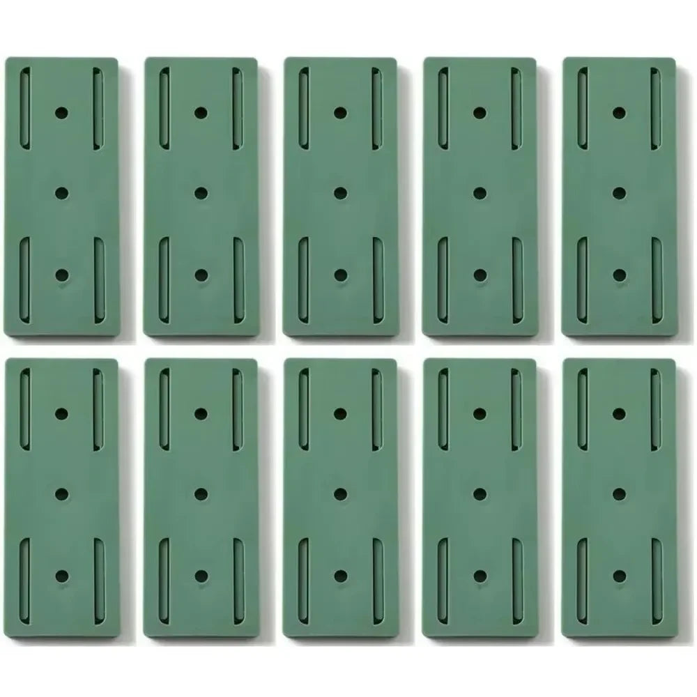 Set of 10 Smartlyo self-adhesive socket holders showing flexible, black plastic clips attached to a surface for organizing cords.