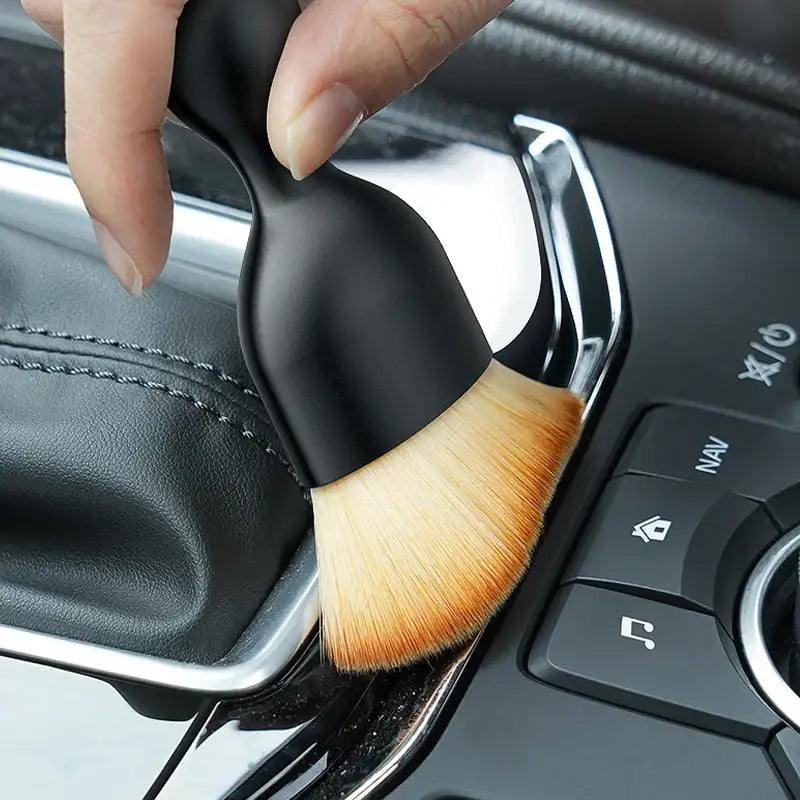 Smartlyo Car interior cleaning fluff brush showing soft bristles and compact design for effective dust removal inside vehicles.