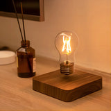 Magnetic levitation lamp by Smartlyo floating above its base with a sleek, modern design and glowing illumination.
