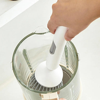 Smartlyo multifunctional kitchen cleaning brush with ergonomic handle and versatile bristles for scrubbing dishes and surfaces.