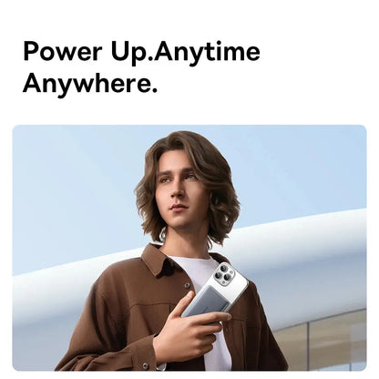 Smartlyo Baseus 5000mAh magnetic power bank connected to a smartphone for portable charging.