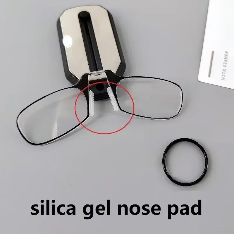 Folding pocket reading glasses with black frame, compact design, and flexible temples for easy portability and clear vision.