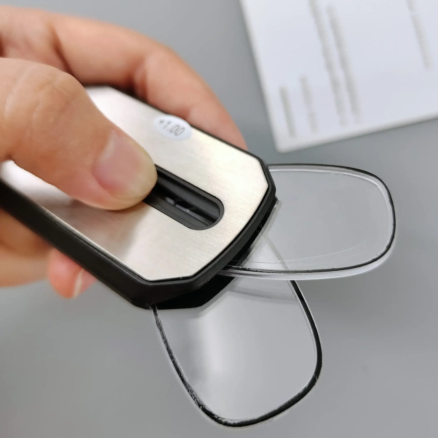 Folding pocket reading glasses with case, compact design, and black frames, ideal for portable use and reading on the go.