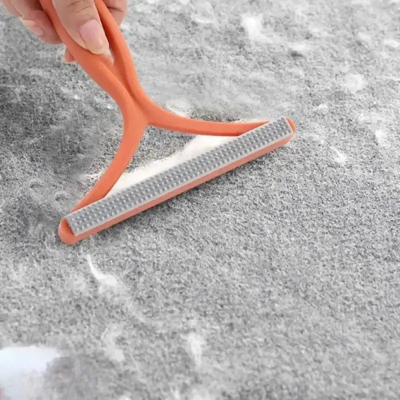 Double-sided pet hair remover by Smartlyo with textured surface for effective pet hair removal from furniture and clothing.