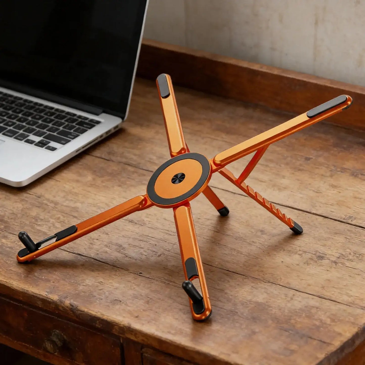 Foldable magnetic iPhone holder and laptop stand by Smartlyo, featuring sleek design and portable functionality for convenient device support.